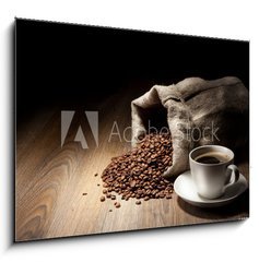 Obraz   Coffee cup with burlap sack of roasted beans on rustic table, 100 x 70 cm