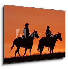 Obraz 1D - 100 x 70 cm F_E47782535 - Cowboys on Horseback Silhouette at sunset - Cowboys na koni silueta pi zpadu slunce