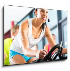 Sklenn obraz 1D - 100 x 70 cm F_E48214367 - Leute beim Spinning in einem Fitnessstudio