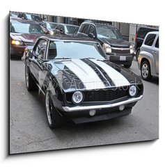 Obraz 1D - 100 x 70 cm F_E65500972 - American muscle car on a street in Chicago