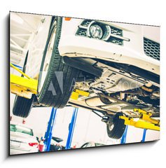 Obraz 1D - 100 x 70 cm F_E69826596 - Lifted Car Maintenance - drba zdvienho vozu