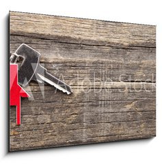 Sklenn obraz 1D - 100 x 70 cm F_E72381127 - Symbol of the house with silver key on vintage wooden background - Symbol domu se stbrnm klem na vinobran devn pozad