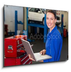 Obraz 1D - 100 x 70 cm F_E76801978 - Mechanic typing on a laptop