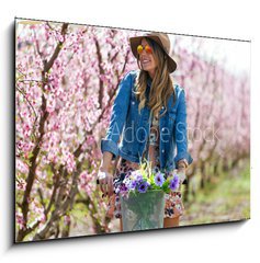 Obraz   Beautiful young woman with a vintage bike in the field., 100 x 70 cm