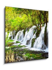 Obraz 1D - 50 x 50 cm F_F107722539 - Scenic waterfall with crystal clear water among green forest