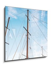 Sklenn obraz 1D - 50 x 50 cm F_F166856176 - Masts of sailboat and blue sky - Story plachetnice a modr oblohy
