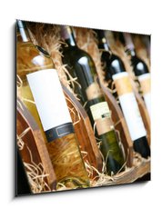 Obraz 1D - 50 x 50 cm F_F20727251 - Closeup shot of wineshelf. Bottles lay over straw. - Detailní záběr z vinárny. Láhve ležely přes slámu.