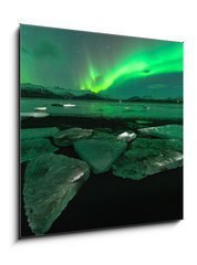 Obraz 1D - 50 x 50 cm F_F209731470 - A beautiful green and red aurora dancing over the Jokulsarlon lagoon, Iceland - Krsn zelen a erven aurora tanc nad lagunou Jokulsarlon, Island