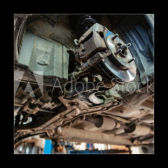 Obraz 1D - 50 x 50 cm F_F265635496 - old car on the lift at auto repair shop