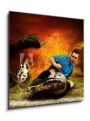 Sklenn obraz 1D - 50 x 50 cm F_F27573195 - Football player in fires flame on the outdoors field