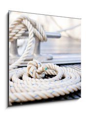 Obraz 1D - 50 x 50 cm F_F35006836 - Mooring rope with a knotted end tied around a cleat.