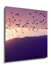 Obraz 1D - 50 x 50 cm F_F37700640 - Flock of Birds Flying at the Sunset above Mountian at the sunset - Stádo ptáků Létajících při západu slunce nad Mountian při západu slunce
