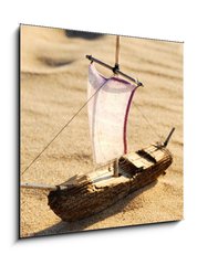 Obraz 1D - 50 x 50 cm F_F39733382 - wooden sail ship toy model in the sea sand - dřevěná plachetnice model hračky v mořském písku