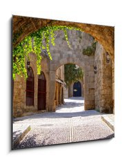 Sklenn obraz 1D - 50 x 50 cm F_F43877162 - Medieval arched street in the old town of Rhodes, Greece