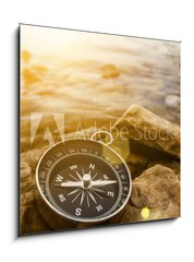 Sklenn obraz 1D - 50 x 50 cm F_F60262537 - compass on the shore at sunrise