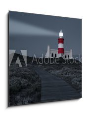 Obraz 1D - 50 x 50 cm F_F78333041 - Lighthouse with shining light in darkness and dark blue clouds a - Maják se zářícím světlem ve tmě a tmavě modrými oblaky a