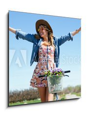 Sklenn obraz 1D - 50 x 50 cm F_F81062127 - Beautiful young woman with a vintage bike in the field. - Krsn mlad ena s vintage kolo v poli.