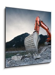 Sklenn obraz 1D - 50 x 50 cm F_F81423741 - heavy organge excavator with shovel standing on hill with rocks - tk varhany rypadlo s lopatou stojc na kopci s kameny