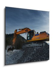 Obraz 1D - 50 x 50 cm F_F81767537 - sideview of huge orange shovel excavator digging in gravel - bon pohled na obrovsk bagr oranov lopaty kopn trku