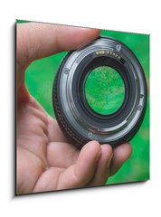Skleněný obraz 1D - 50 x 50 cm F_F88270999 - Mobile lenses on a green lawn. - Mobilní čočky na zeleném trávníku.