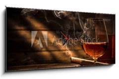 Obraz s hodinami 1D - 120 x 50 cm F_AB105845234 - Whiskey with smoking cigar - Whisky s kouřícím doutníkem