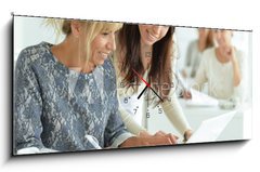 Obraz s hodinami 1D panorama - 120 x 50 cm F_AB132241834 - women working together in office
