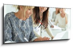 Obraz s hodinami 1D panorama - 120 x 50 cm F_AB132241834 - women working together in office