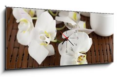 Obraz s hodinami 1D panorama - 120 x 50 cm F_AB15837732 - Face cream and white orchid on a bamboo mate - Krém na obličej a bílá orchidej na bambusové kamarádce