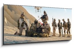 Obraz s hodinami 1D panorama - 120 x 50 cm F_AB164038449 - Soldiers are Using Drone for Scouting During Military Operation in the Desert.