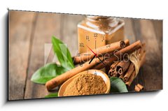 Obraz s hodinami 1D panorama - 120 x 50 cm F_AB224205694 - Fresh cinnamon sticks and powder