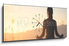Obraz s hodinami 1D panorama - 120 x 50 cm F_AB245653305 - silhouette fitness girl practicing yoga on mountain