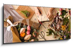 Obraz s hodinami 1D panorama - 120 x 50 cm F_AB266667837 - Florist writing in notebook at table