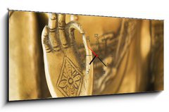 Obraz s hodinami 1D panorama - 120 x 50 cm F_AB26799446 - Hand of the golden Buddha 02 - Ruka zlatého Buddhy 02