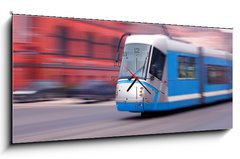 Obraz s hodinami 1D panorama - 120 x 50 cm F_AB30286371 - Modern blue tram rider fast on rails - Moderní modrá tramvajová jezdec rychle na kolejích