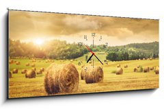 Obraz s hodinami 1D panorama - 120 x 50 cm F_AB31838189 - Field of freshly bales of hay with beautiful sunset