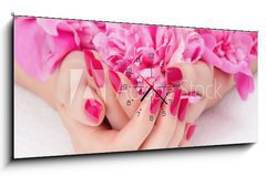 Obraz s hodinami   Woman cupped hands with pink manicure holding a flower, 120 x 50 cm