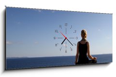 Obraz s hodinami 1D panorama - 120 x 50 cm F_AB35709780 - girl sitting on rock over ocean - dívka sedí na skále nad oceánem