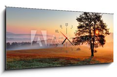 Obraz s hodinami   Alone tree on meadow at sunset with sun and mist, 120 x 50 cm