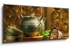 Obraz s hodinami   Asian herb tea on an old rustic table, 120 x 50 cm