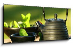 Obraz s hodinami   Black iron asian teapot with sprigs of mint for tea, 120 x 50 cm