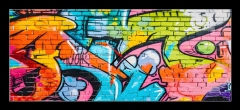 Obraz s hodinami 1D panorama - 120 x 50 cm F_AB715124495 - wall scratched with colorful graffiti and drawings. colorful graffiti brick wall urban visual