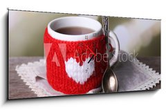 Obraz s hodinami 1D panorama - 120 x 50 cm F_AB71618914 - Cup of tasty hot tea, on wooden table, on light background - Šálek chutného horkého čaje, na dřevěném stole, na světlém pozadí