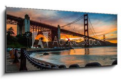 Obraz s hodinami 1D panorama - 120 x 50 cm F_AB72399300 - burning sky over Golden gate Bridge
