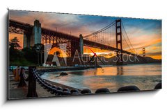 Obraz s hodinami 1D panorama - 120 x 50 cm F_AB72399300 - burning sky over Golden gate Bridge - hořící obloha nad Mostem Zlaté brány