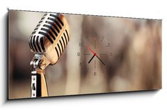 Obraz s hodinami 1D panorama - 120 x 50 cm F_AB74009701 - Silver vintage microphone in the studio on blured background