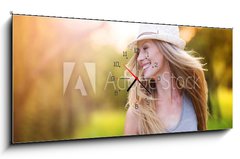 Obraz s hodinami   Beautiful woman outside in a park., 120 x 50 cm