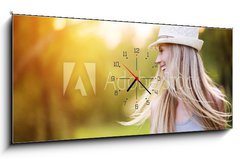 Obraz s hodinami 1D panorama - 120 x 50 cm F_AB76895650 - Beautiful woman outside in a park. - Krásná žena venku v parku.