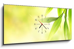 Obraz s hodinami 1D - 120 x 50 cm F_AB8266726 - Green bamboo leaves over abstract blurred background