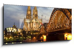 Obraz s hodinami 1D panorama - 120 x 50 cm F_AB9675612 - Cologne by Night 01 - Kolín nad Ním 01