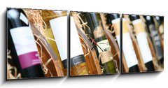 Obraz s hodinami 3D tdln - 150 x 50 cm F_BM20727251 - Closeup shot of wineshelf. Bottles lay over straw.